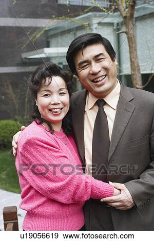 Portrait of a mature couple embracing each other View Large Photo Image Stock Photo - Portrait of a mature couple embracing each other. Fotosearch