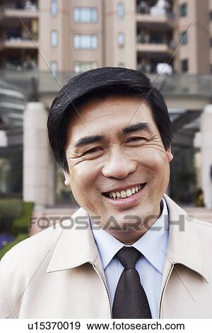 Portrait of a mature man smiling View Large Photo Image Stock Photo - Portrait of a mature man smiling. Fotosearch