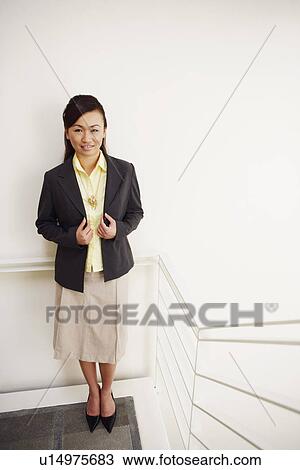 Portrait of a young woman smiling View Large Photo Image Stock Image - Portrait of a young woman smiling. Fotosearch