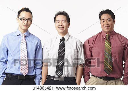 Portrait of three businessmen smiling View Large Photo Image Stock Image - Portrait of three businessmen smiling. Fotosearch