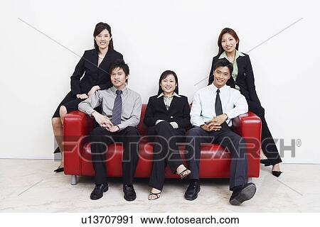 Portrait of three businesswomen and two businessmen smiling View Large Photo Image Stock Image - Portrait of three businesswomen and two businessmen smiling. Fotosearch