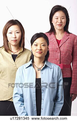 Stock Photography - Portrait of three businesswomen smiling. Fotosearch