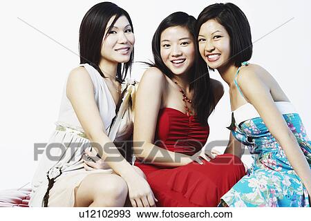 Portrait of three young women smiling View Large Photo Image Stock Image - Portrait of three young women smiling. Fotosearch