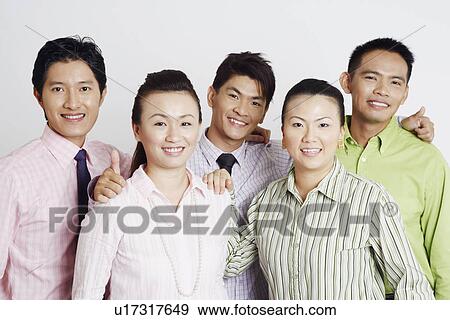 Stock Photo - Portrait of two businesswomen and three businessmen smiling. Fotosearch