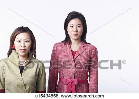 Portrait of two businesswomen smiling View Large Photo Image Stock Photograph - Portrait of two businesswomen smiling. Fotosearch