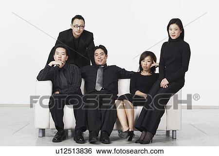Three young men and two young women on a couch View Large Photo Image Stock Photograph - Three young men and two young women on a couch. Fotosearch