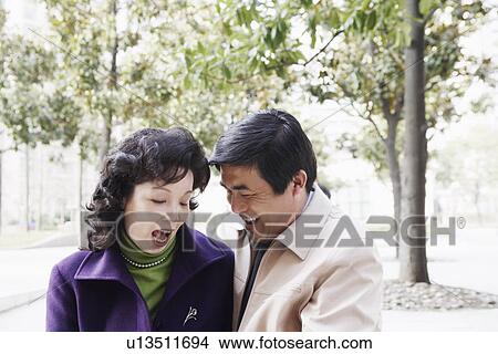 Close-up of a mature couple laughing together View Large Photo Image Picture - Close-up of a mature couple laughing together. Fotosearch
