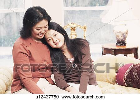 Close-up of a mother and her daughter View Large Photo Image Stock Image - Close-up of a mother and her daughter. Fotosearch