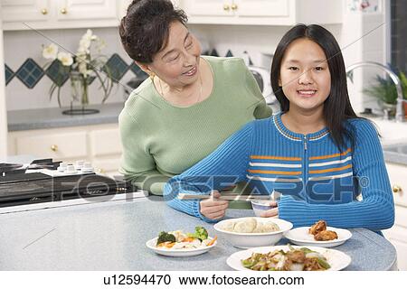 Stock Image - Portrait of a girl and her grandmother. Fotosearch