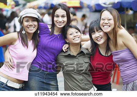Portrait of a group of young women smiling View Large Photo Image Picture - Portrait of a group of young women smiling. Fotosearch