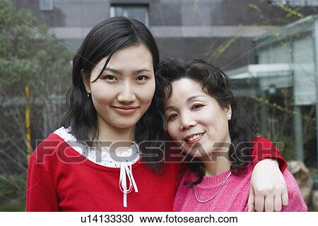 Portrait of a mature woman with her daughter View Large Photo Image Stock Image - Portrait of a mature woman with her daughter. Fotosearch