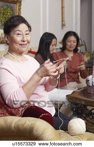 Portrait of a senior woman knitting View Large Photo Image Stock Photo - Portrait of a senior woman knitting. Fotosearch