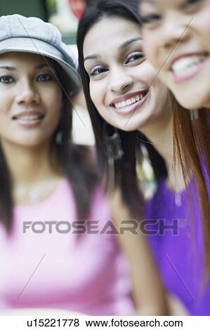 Portrait of three young women smiling View Large Photo Image Stock Photo - Portrait of three young women smiling. Fotosearch