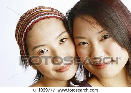 Portrait of two young women posing View Large Photo Image Stock Photo - Portrait of two young women posing. Fotosearch