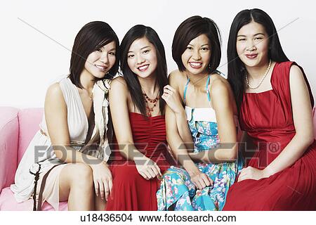 Close-up of four young women sitting together View Large Photo Image Picture - Close-up of four young women sitting together. Fotosearch