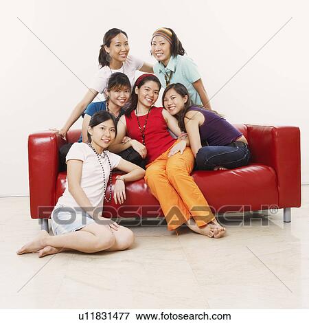 Stock Photo - Portrait of a group of young women smiling. Fotosearch