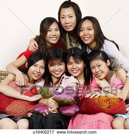 Portrait of a group of young women looking posing View Large Photo Image Stock Photo - Portrait of a group of young women looking posing. Fotosearch