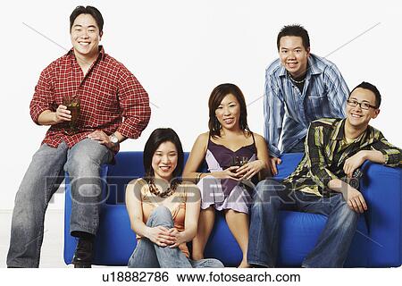 Portrait of two young women and three young men smiling View Large Photo Image Stock Photograph - Portrait of two young women and three young men smiling. Fotosearch