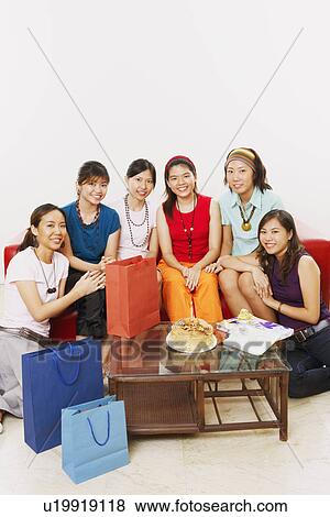 Portrait of a group of young women smiling at a birthday party View Large Photo Image Stock Photo - Portrait of a group of young women smiling at a birthday party. Fotosearch