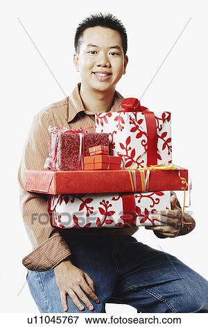 Portrait of a young man smiling View Large Photo Image Stock Photo - Portrait of a young man smiling. Fotosearch