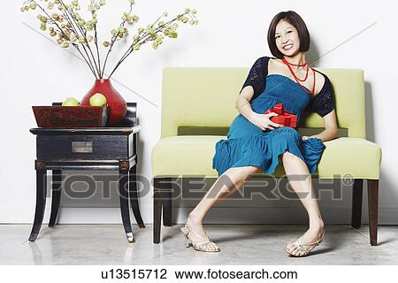Stock Image - Portrait of a young woman smiling. Fotosearch