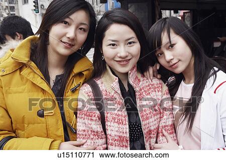 Portrait of three young women smiling View Large Photo Image Stock Image - Portrait of three young women smiling. Fotosearch