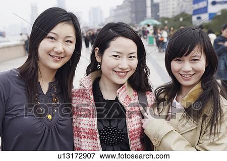 Portrait of three young women smiling View Large Photo Image Stock Photo - Portrait of three young women smiling. Fotosearch