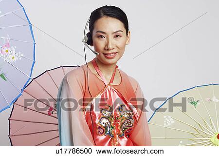 Portrait of a mid adult woman smiling View Large Photo Image Stock Image - Portrait of a mid adult woman smiling. Fotosearch