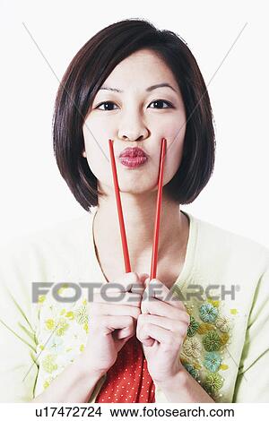 Portrait of a young woman puckering View Large Photo Image Picture - Portrait of a young woman puckering. Fotosearch