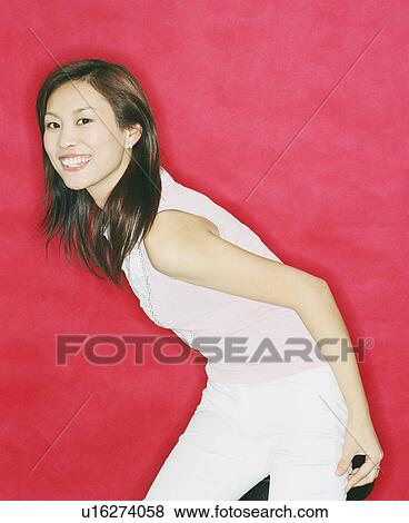 Stock Photo - Portrait of a young woman smiling. Fotosearch