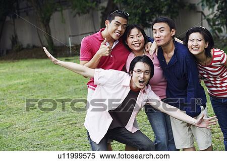 Stock Photography - Portrait of five people looking cheerful. Fotosearch