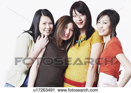 Portrait of four young women smiling View Large Photo Image Stock Image - Portrait of four young women smiling. Fotosearch
