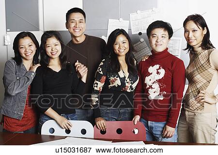 Portrait of a group of office workers smiling View Large Photo Image Stock Photo - Portrait of a group of office workers smiling. Fotosearch