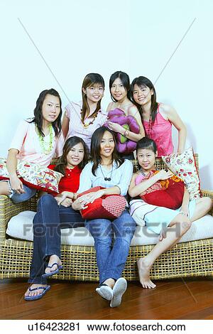 Stock Image - Portrait of a group of young women posing. Fotosearch