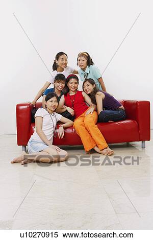 Stock Photography - Portrait of a group of young women smiling. Fotosearch