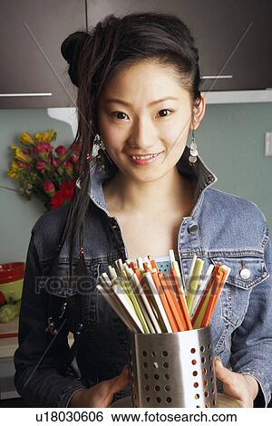 Stock Photograph - Close-up of a teenage girl smiling. Fotosearch