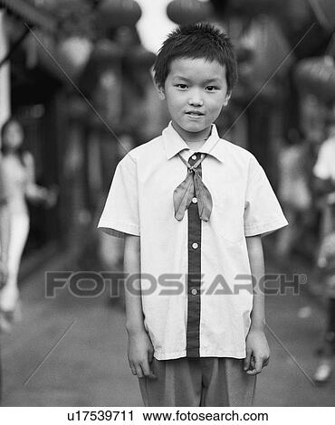 Stock Image - Portrait of a boy standing. Fotosearch