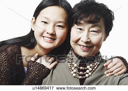 Stock Photo - Portrait of a grandmother with her granddaughter. Fotosearch