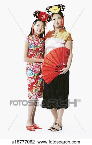 Stock Image - Portrait of a mother and her daughter smiling. Fotosearch