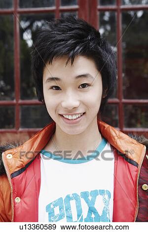 Portrait of a teenage boy smiling View Large Photo Image Stock Photo - Portrait of a teenage boy smiling. Fotosearch