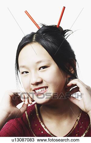 Stock Image - Portrait of a teenage girl smiling. Fotosearch