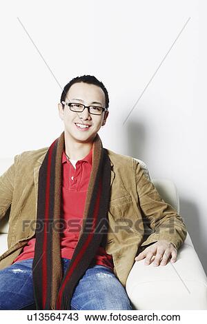 Stock Image - Portrait of a young man smiling. Fotosearch