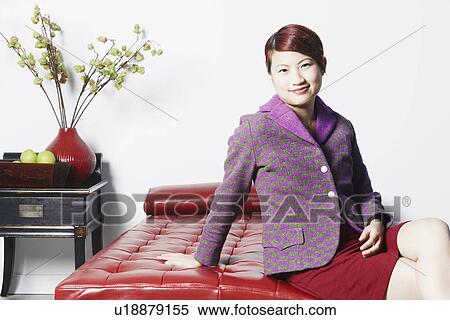 Stock Photography - Portrait of a young woman smiling. Fotosearch