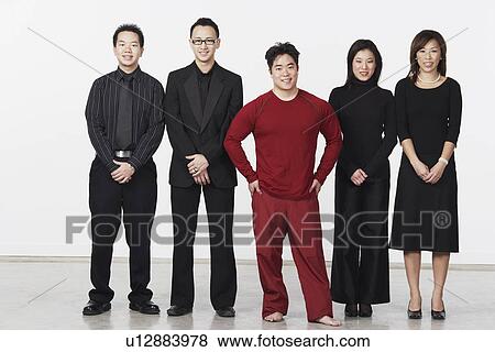 Portrait of three young men and two young women standing View Large Photo Image Stock Photo - Portrait of three young men and two young women standing. Fotosearch