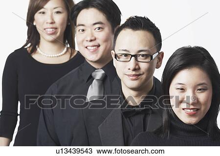 Portrait of two young men and two young women smiling View Large Photo Image Stock Image - Portrait of two young men and two young women smiling. Fotosearch