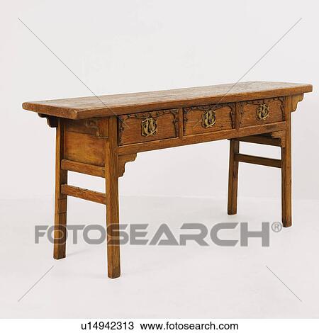 Stock Image - Close-up of a wooden desk. Fotosearch