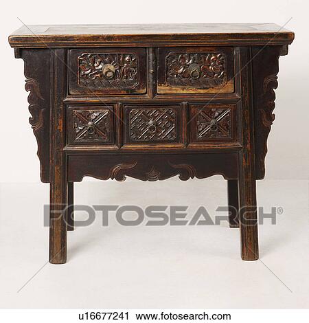 Stock Image - Close-up of a wooden side table. Fotosearch