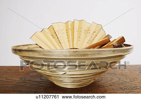 Close-up of folding fans in a basket View Large Photo Image Stock Image - Close-up of folding fans in a basket. Fotosearch