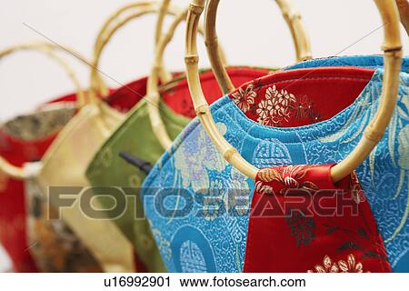 Close-up of four hand bags View Large Photo Image Stock Image - Close-up of four hand bags. Fotosearch