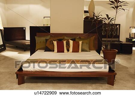 Stock Photo - Double bed in a furniture store. Fotosearch